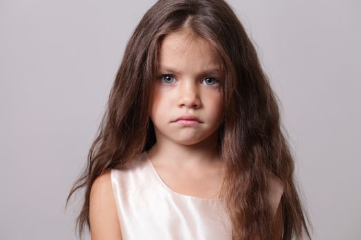 Closeup portrait of angry little girl