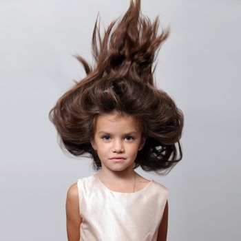 portrait of little girl with extravagant hair on his head