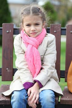 portrait of a beautiful girl in a pink scarf