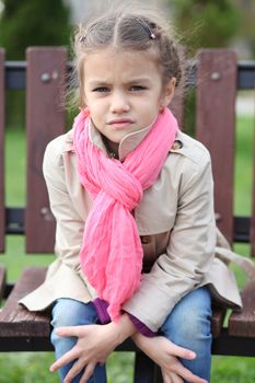 portrait of a beautiful girl in a pink scarf