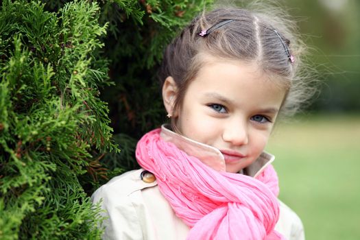 portrait of a beautiful girl in a pink scarf