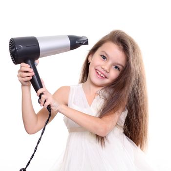 little girl posing with hair dryer isolated on white