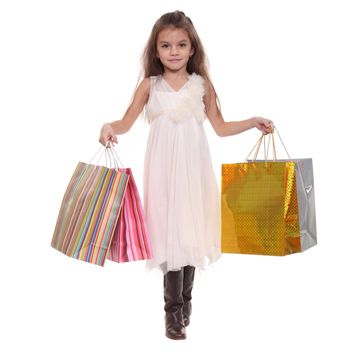 Beautiful little girl with shopping bags