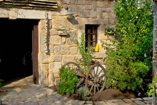 Old rusty plough in stone street of Dalmatian village