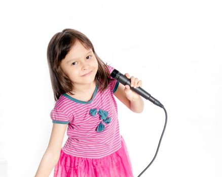 Asian female child singing with a microphone