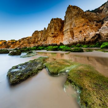 Green Stones at Porto de Mos Beach in Lagos, Algarve, Portugal