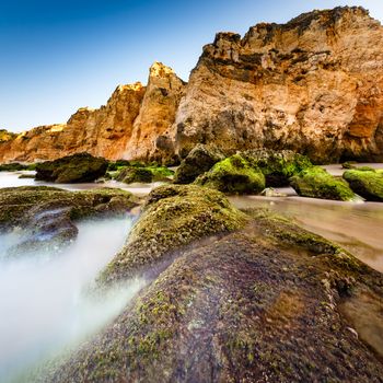 Green Stones at Porto de Mos Beach in Lagos, Algarve, Portugal