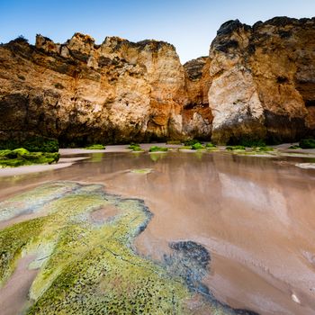 Green Stones at Porto de Mos Beach in Lagos, Algarve, Portugal