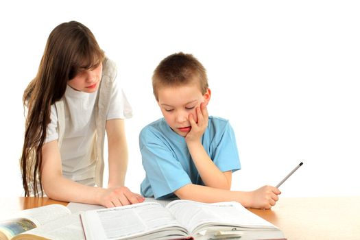 teenage girl and schoolboy on the table with exercise books