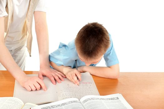 teenage girl and schoolboy on the table with exercise books