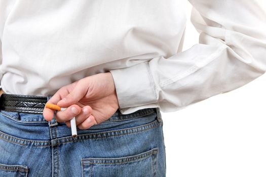 Man breaking a cigarette behind his back. Rear view closeup