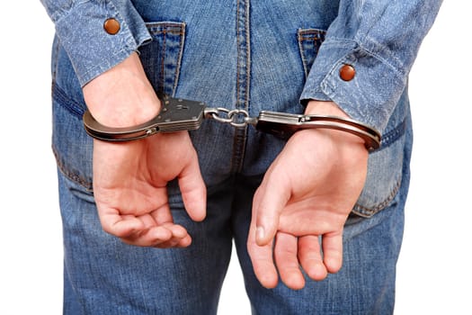 Rear view of the Man in Handcuffs on the White Background Closeup