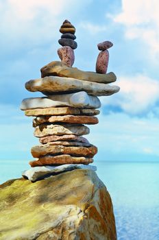 Pile of pebbles on the sea boulder