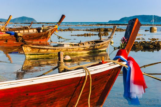 Fishing boats on the sea shore in Phuket, Thailand