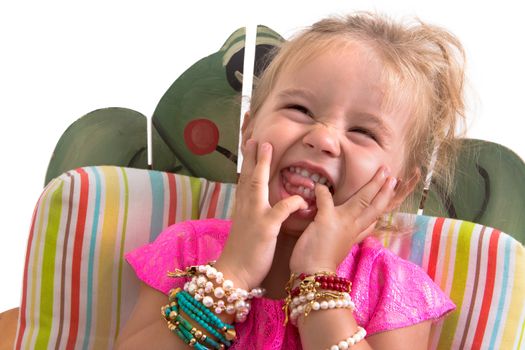 child sitting and laughing isolated on white