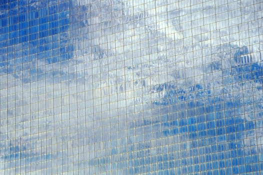 reflection of clouds on Corporate glass building