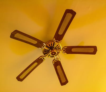 Ceiling fan hanging from a vaulted ceiling