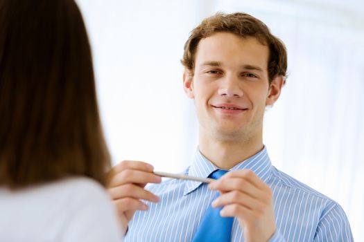 Image of young handsome confident businessman in suit