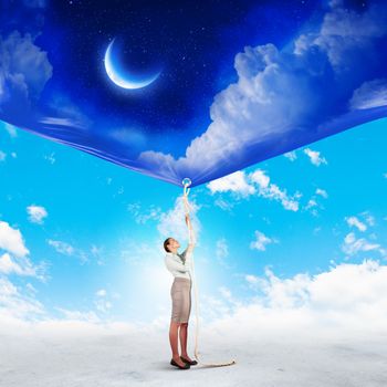Image of businesswoman pulling banner with illustration. Day and night concept