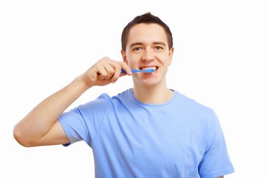 Young man at home brushing teeth in the morning