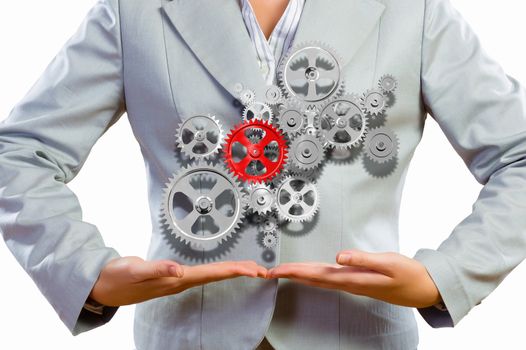 Close up image of businesswoman holding gears in hands