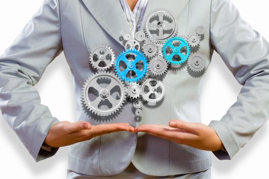 Close up image of businesswoman holding gears in hands