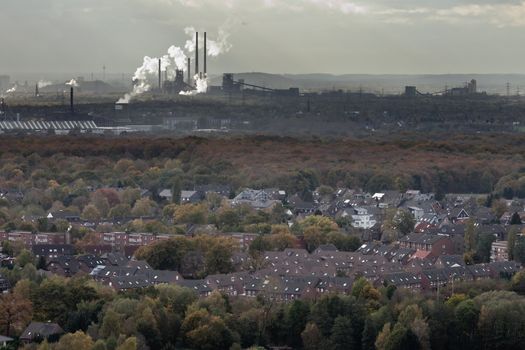 residential urban area of Oberhausen  Germany  Europe  with heavy industry of the Ruhr Area  Ruhrgebiet  in background