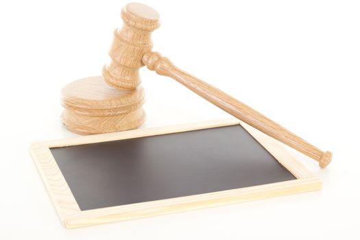 Gavel made of oak wood with blank blackboard