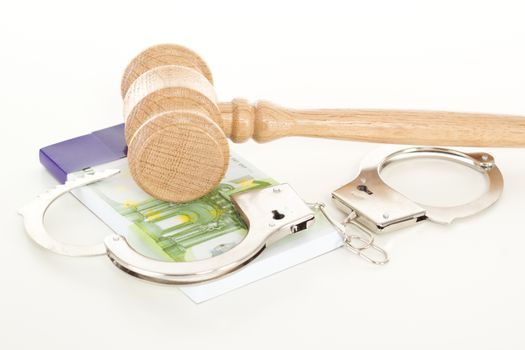 Gavel with money and handcuffs
