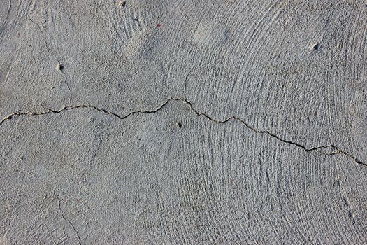 Grunge concrete cement wall with crack in industrial building