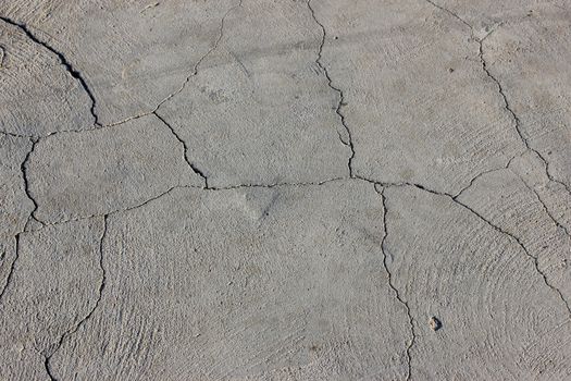 Grunge concrete cement wall with crack in industrial building