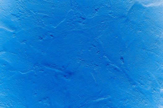 Blue plastered wall background or texture.