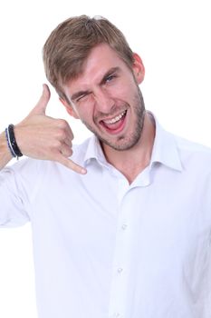 Young man using a call me gesture and a phone