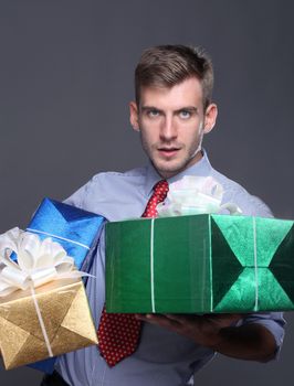 Portrait of young business man with gifts