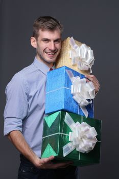 Portrait of young business man with gifts