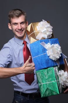 Portrait of young business man with gifts