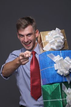 Portrait of young business man with gifts