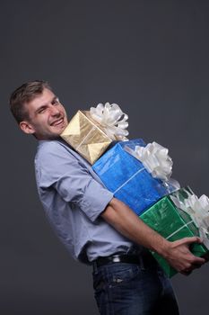 Portrait of young business man with gifts