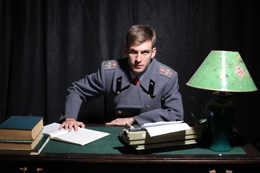 Russian military officer in a dark cabinet