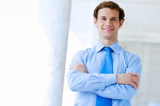 Image of young handsome confident businessman in suit