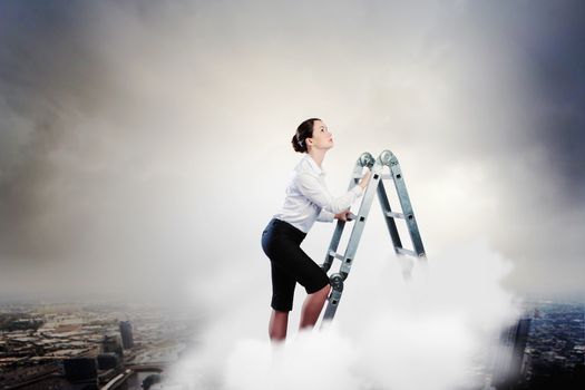 Image of young ambitious businesswoman climbing ladder. Promotion concept