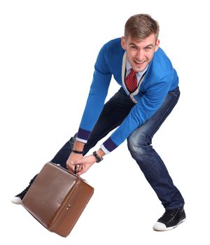 A young man carrying a suitcase