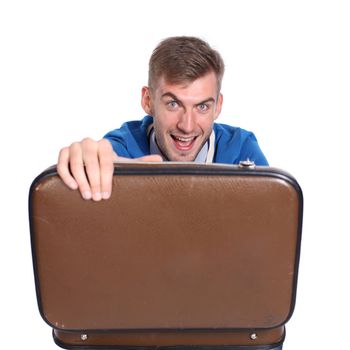 Suspicious businessman holding open briefcase in hands isolated on white