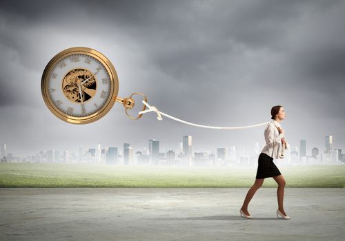 Image of attractive businesswoman and pocket watch. Time for business