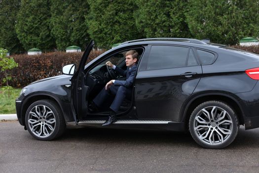 young attractive man young man in the car