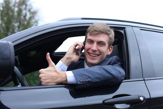 Portrait of young attractive man calling by phone