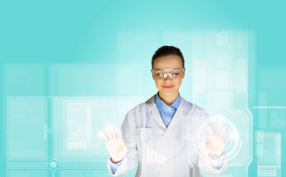 Image of young woman scientist touching icon of media screen