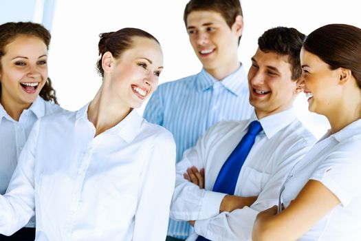 Image of young businesspeople congratulating colleague. Success concept