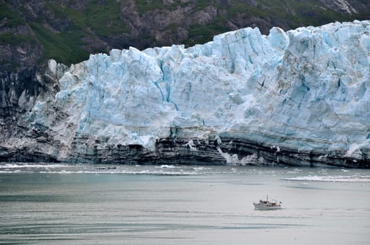  Boat glides past the glaciers