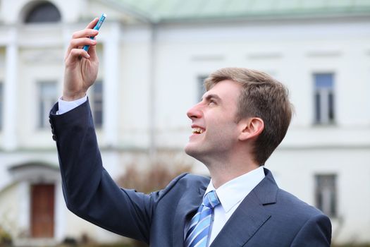 Portrait of young attractive man calling by phone